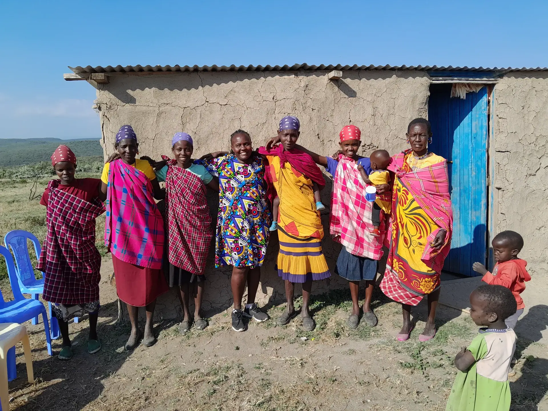 Women, children, and community members participating in Shakenisho’s work in Kenya