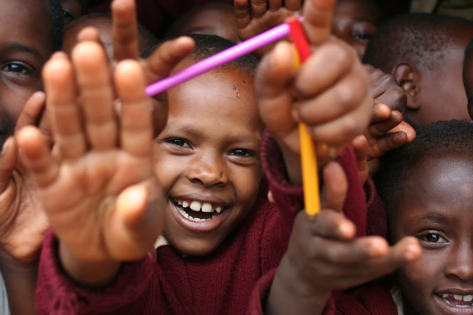 Smiling schoolchildren gathered together for learning